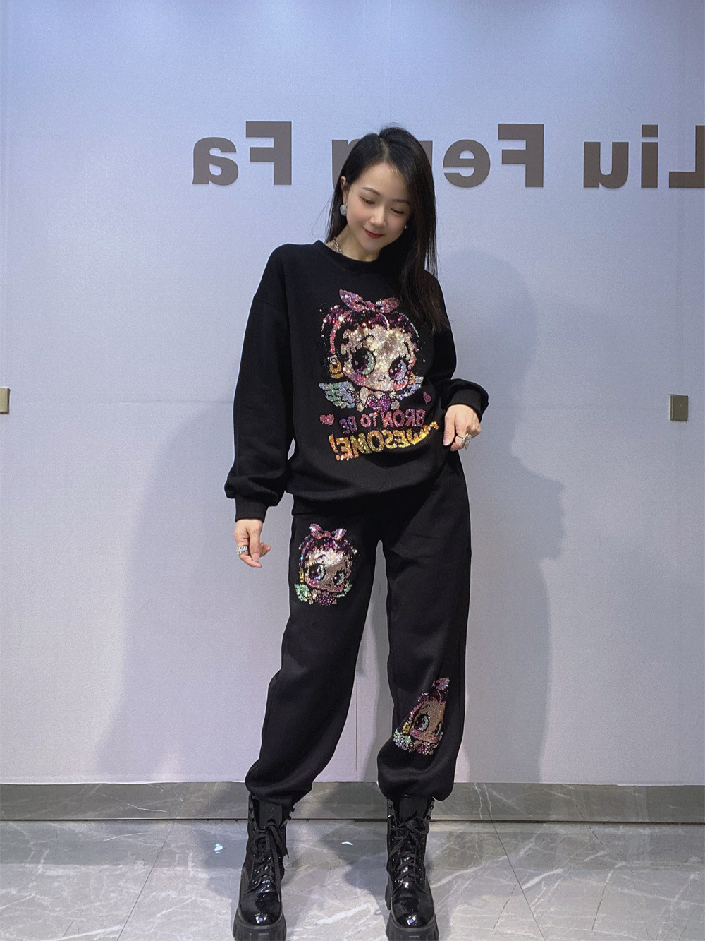 Europa y América ropa de mujer estilo coreano de diamante caliente cuello redondo manga larga suéter de vestir para mujeres de otoño y invierno pantalones sueltos de dos piezas de ropa deportiva
