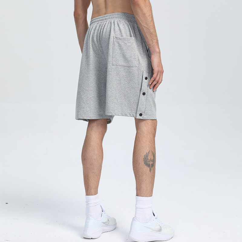 Pantalones cortos deportivos de algodón con botones de color sólido pantalones deportivos de verano transfronterizos de los hombres venta caliente tablero ligero pantalones de fitness que absorben el sudor pantalones de entrenamiento para correr