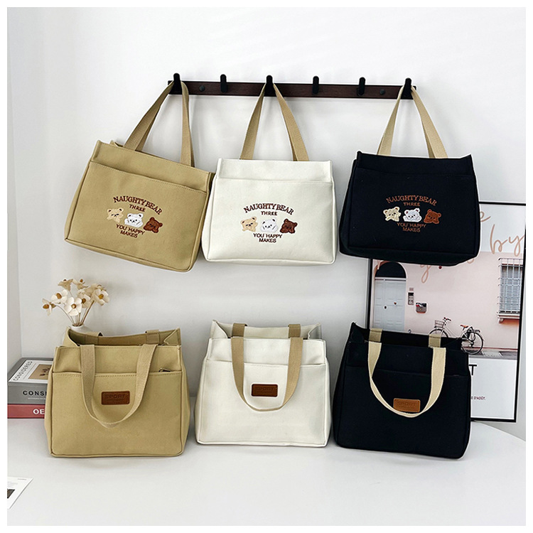 New wholesale fashionable and high-quality canvas handbag, simple and portable, easy to carry for going out, versatile lunch box and bento bag undefined