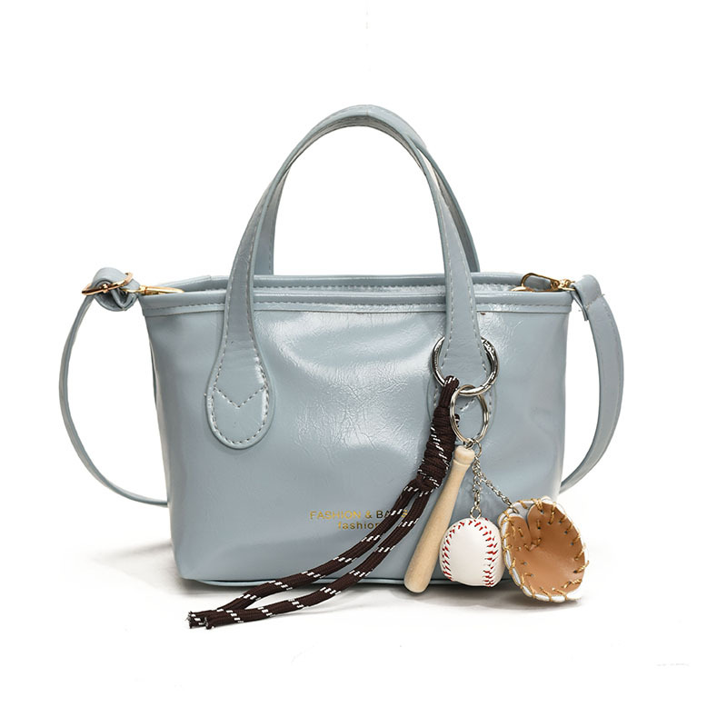 Bolso de cubo de textura de color sólido para mujer 2025 primavera nueva moda bolso de mensajero coreano estilo occidental de alta gama para mujer