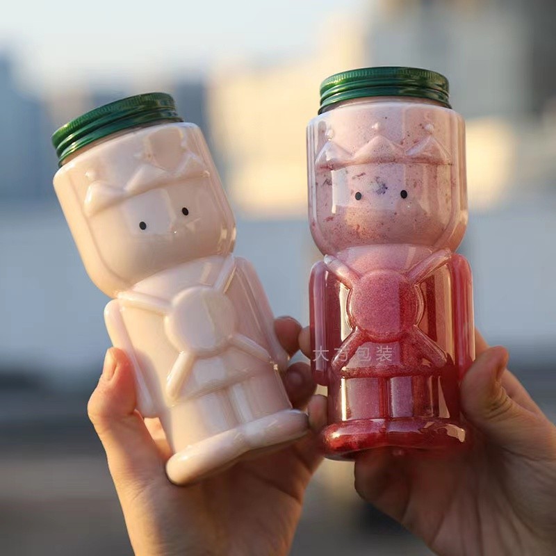 Neto rojo agujero abierto tapa lindo jugo botella de forma especial protector de la botella mascota transparente de dibujos animados botella de plástico botella de té de leche desechable