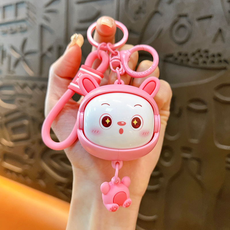 Llavero creativo de dibujos animados girando música lindo descompresión cambio de cara llavero de gato bolsos para hombres y mujeres pequeños regalos al por mayor