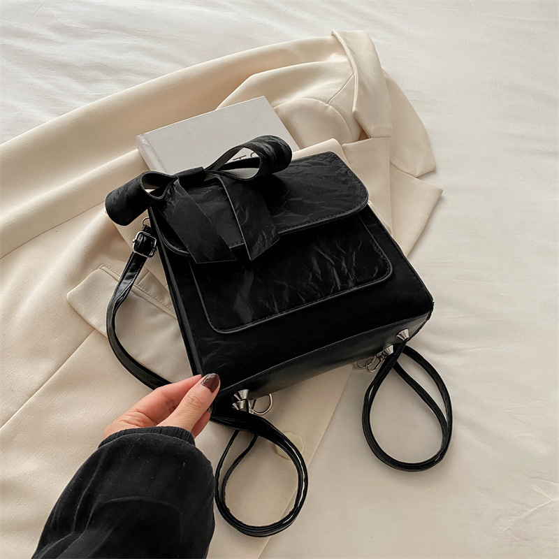 Mochila de hombro de arco para mujeres 2024 nueva moda estilo académico mochila de estilo universal bolso de mano bolso de viaje