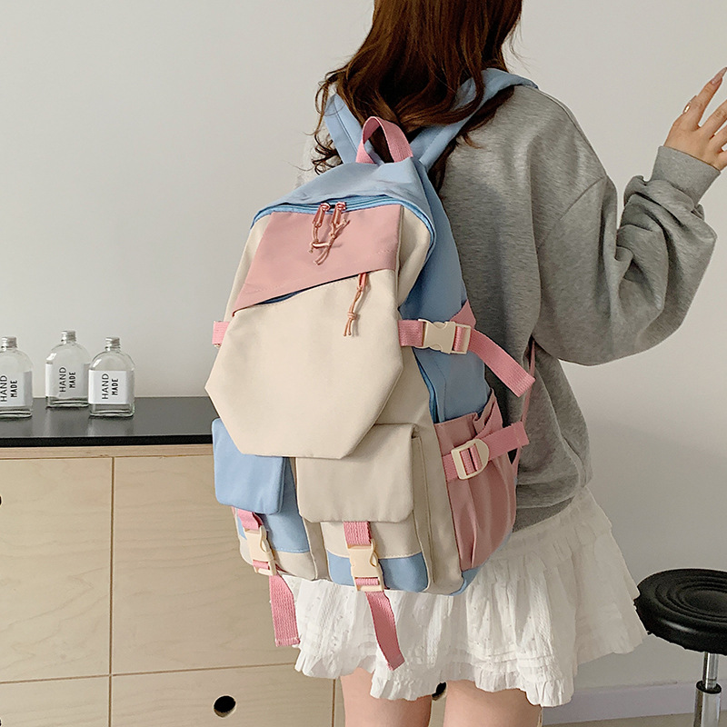 Mochila escolar de gran capacidad para estudiantes de secundaria, mochila de color de contraste simple y versátil, mochila de moda para estudiantes de secundaria y preparatoria al por mayor