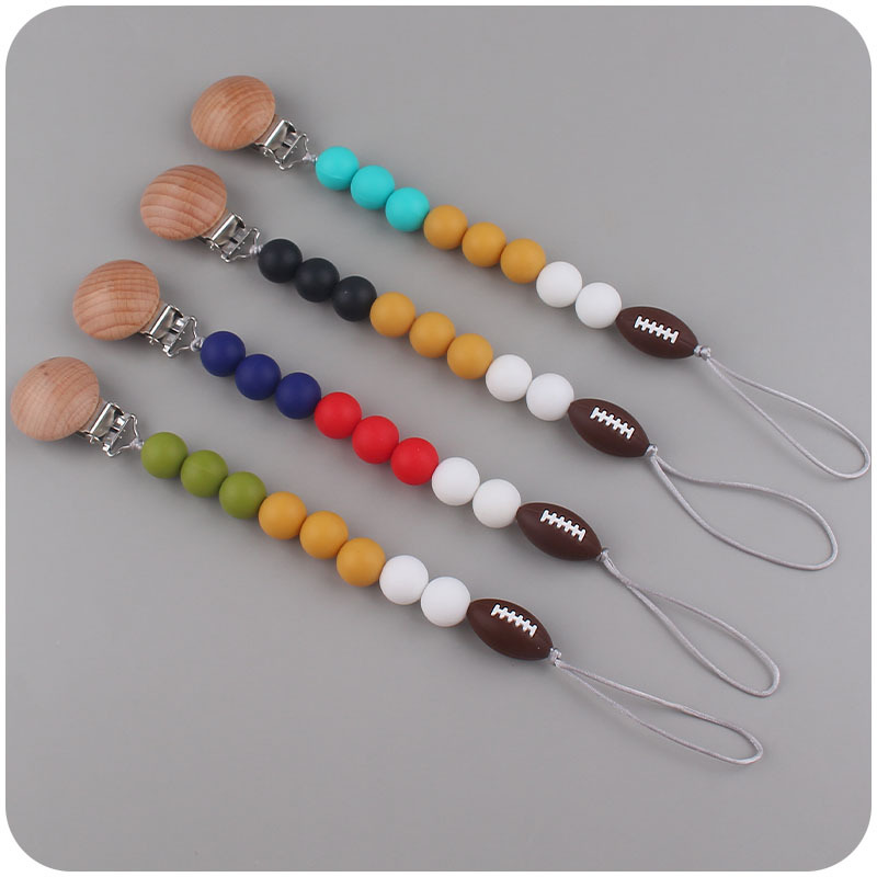 Nuevo bebé suministros de dibujos animados rugby mordedor chupete cadena calmante bebé DIY pulsera mordedor conjunto de dos piezas