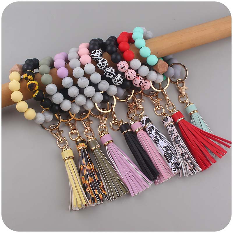 Nuevo cuero creativo pu corto borla colgante de silicona con cuentas muñeca llavero colgante pulsera llavero Accesorios