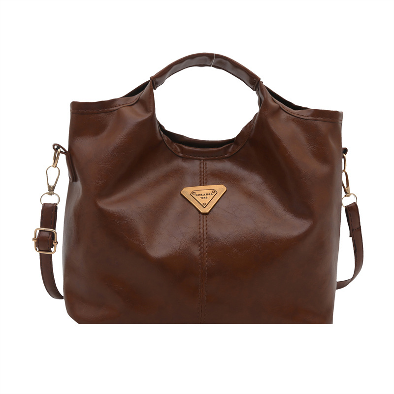 Bolso de mano retrógrado nicho mujer 2025 nuevo estilo de piel de cera de aceite para viajar bolso de hombro de gran capacidad relajado mochila