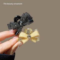ファッショナブルなアクリル製ヘアアクセサリー、軽くて豪華なフルダイヤモンドのリボン、AB面グリップクリップ、ミディアムサイズの後頭部用ハーフタイヘアピン