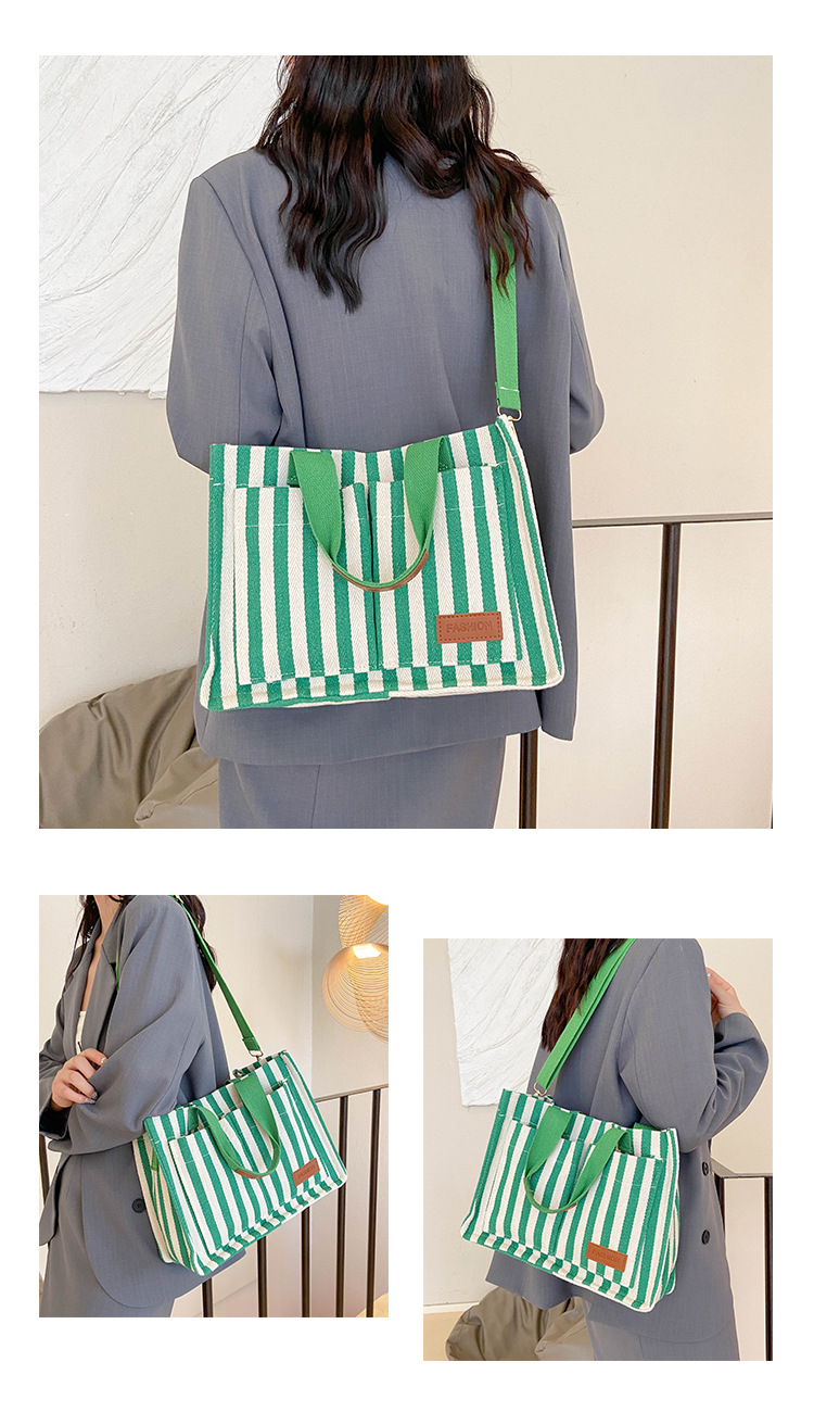 Popular striped canvas 2024 new commuter large capacity casual fashion personalized hand-held crossbody tote women's bag_voghion.com