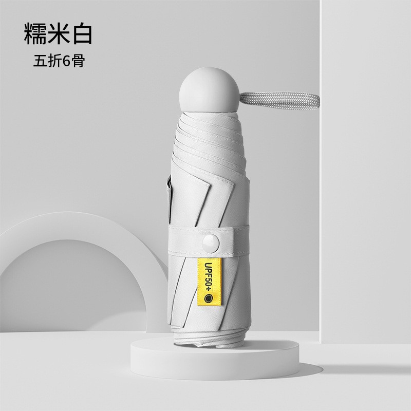 Cincuenta plegables mini cápsula soleado y lluvia para mujeres paraguas de sol de bolsillo de vinilo ultraligero compacto y portátil