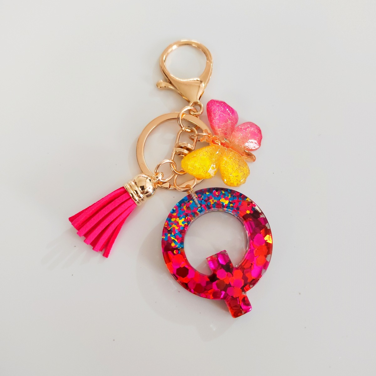 Ventas transfronterizas calientes de letras inglesas de color mixto colgante de llavero colgante de mariposa fringe de resina de llavero colgante de joyería