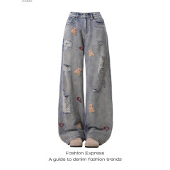 女性用ライトブルーベア刺繍ジーンズ春と秋の新しいアメリカンレトロホットガールリッピングローエッジデザインストレートパンツトレンディ