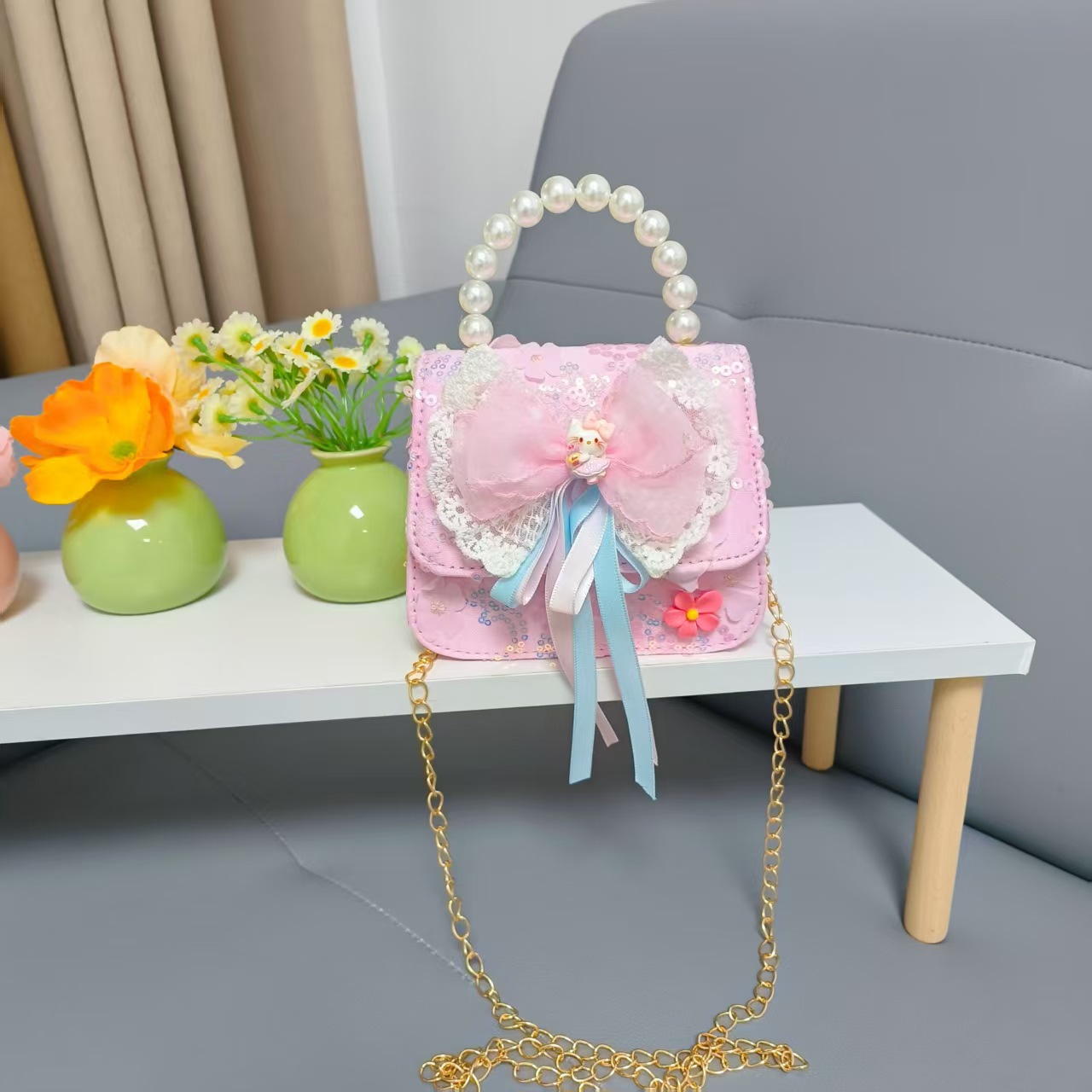 Bow princess pearl bolso Melody KT felino mochila accesorios de chicas pequeñas cadenas de viento fragante bolso para niños