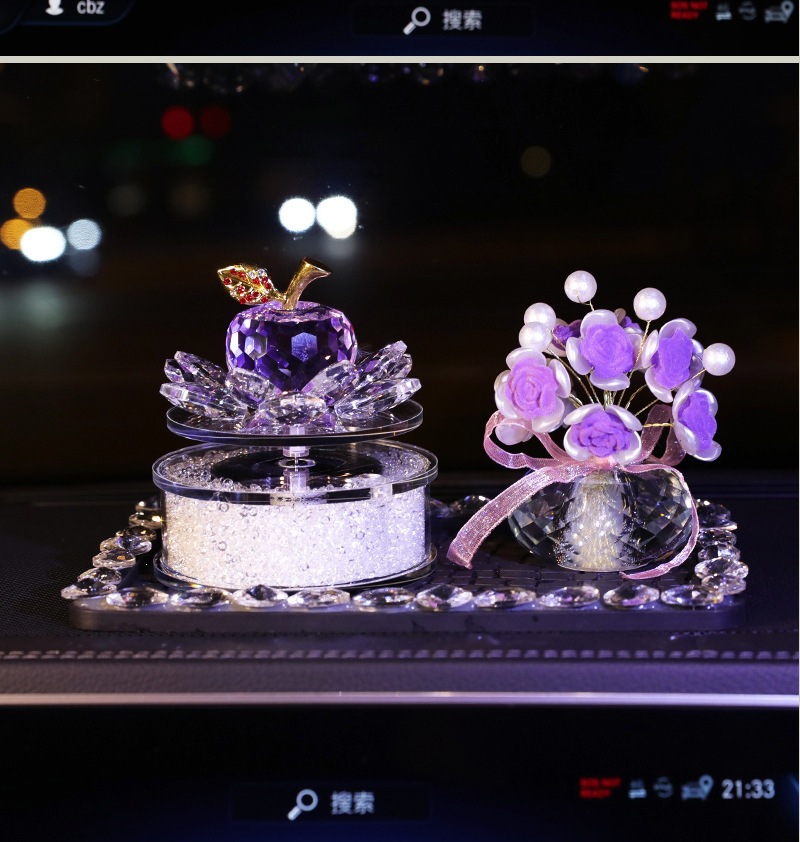 Solar-powered rotating crystal apple car-mounted lotus perfume holder ornament, elegant and feminine car interior accessory for the dashboard