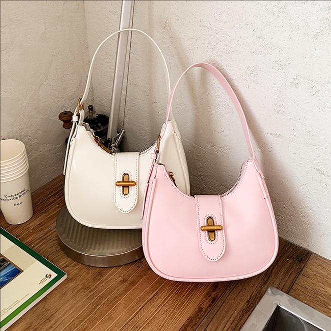 Bolso de brazo de moda de alto nivel, bolso de hombro de alta calidad, nuevo estilo de mujer 2026 simple, bolso de hombro de alta calidad, bolso de transporte universal.