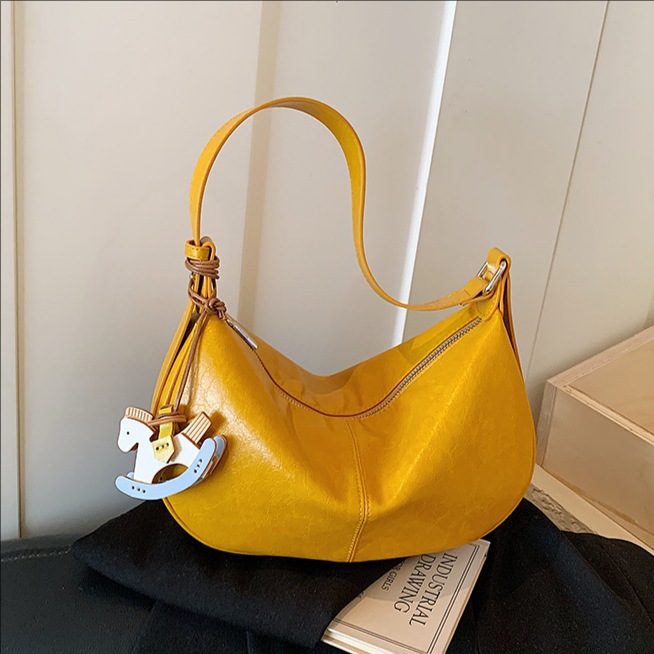 Este año, bolsas de bolinillos populares y simples para mujeres 2026 nuevas texturas diarias de mochila de viaje, bolsas personales de ropa de cama casuales