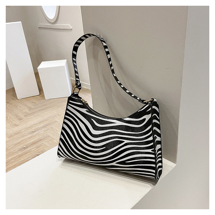 Bolsos de mano de vaca bajo las axilas bolsas de mano bolsas de mujer 2026 nueva moda francesa bolsas de hombro