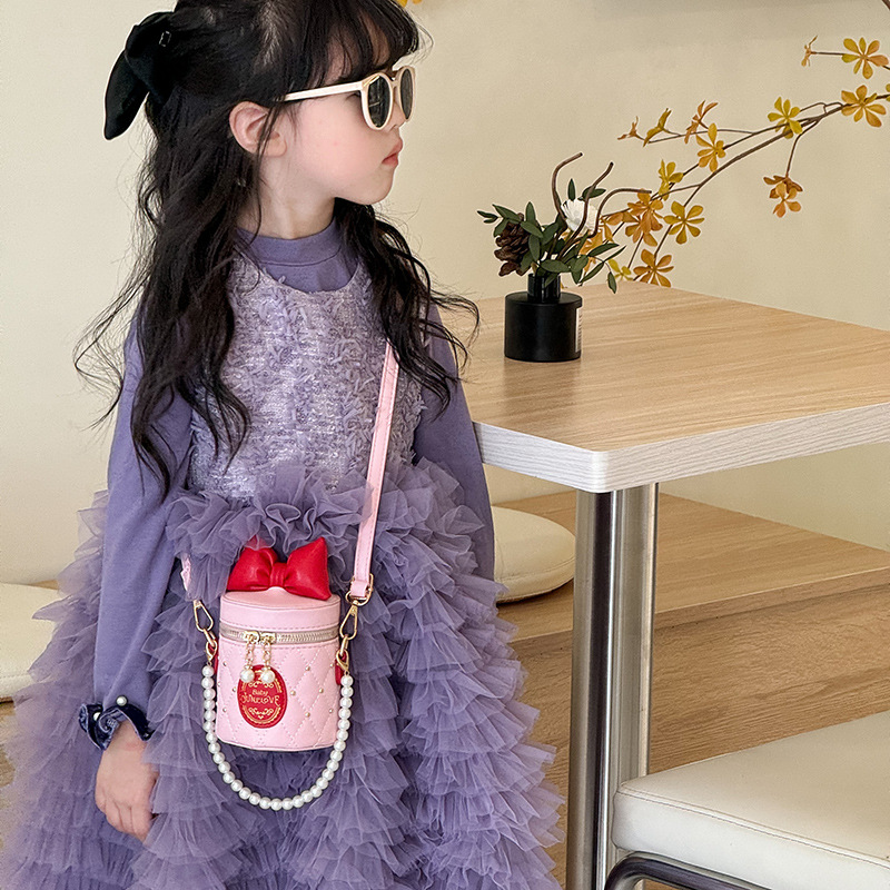 Bolso para niños coreano 2025, nuevo lindo bolso de arco, bolso de cubo, bolso de hombro de cadena de perlas de chicas