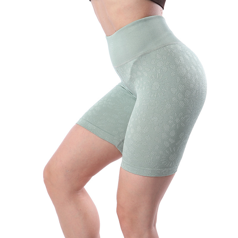 Pantalones cortos de fitness de cadera de melocotón europeos y americanos pantalones de cinco puntos deportivos ajustados con estampado de mujer pantalones cortos de yoga de cintura alta sin costuras