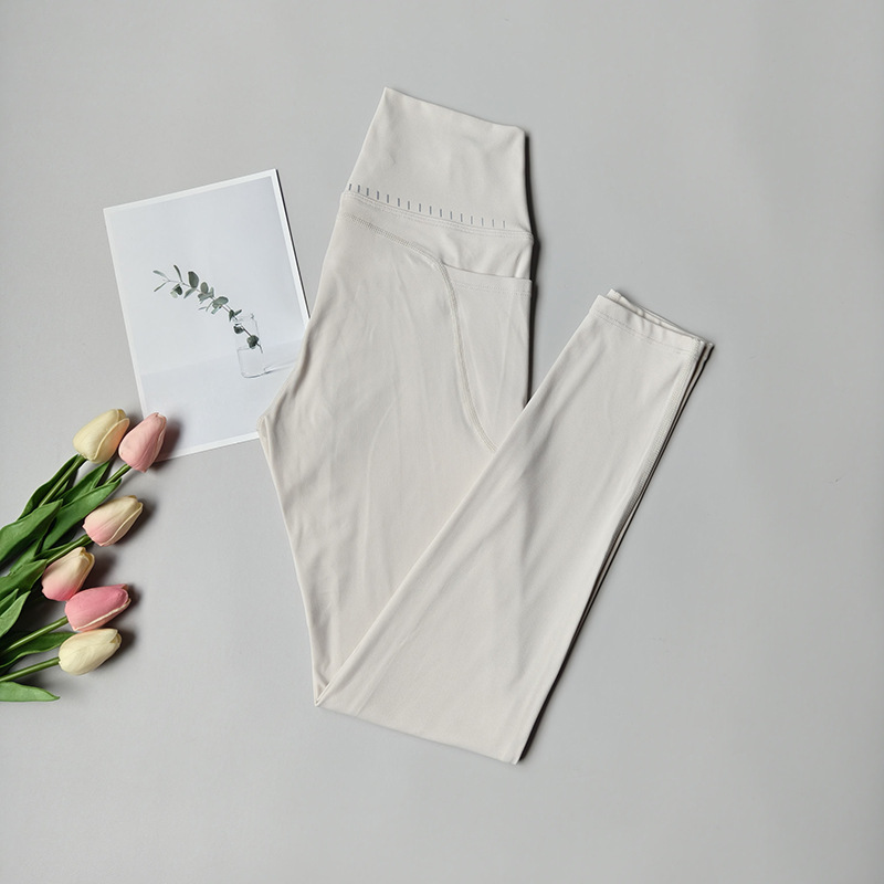 Pantalones de fitness desnudos para mujeres sonrientes líneas de elevación de cadera pantalones deportivos para mujeres al aire libre cintura alta sin marcas nueve puntos pantalones de calzado