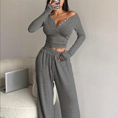2025 ヨーロッパとアメリカのクロスボーダー秋の新作スーツ長袖ボタン付き無地タイトトップと長ズボンの女性用 2 点セット