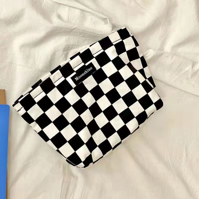 Bolsa de cosméticos original nicho diseño blanco y negro elegante a rayas retro artístico elegante portátil de mano bolsa de cosméticos al por mayor