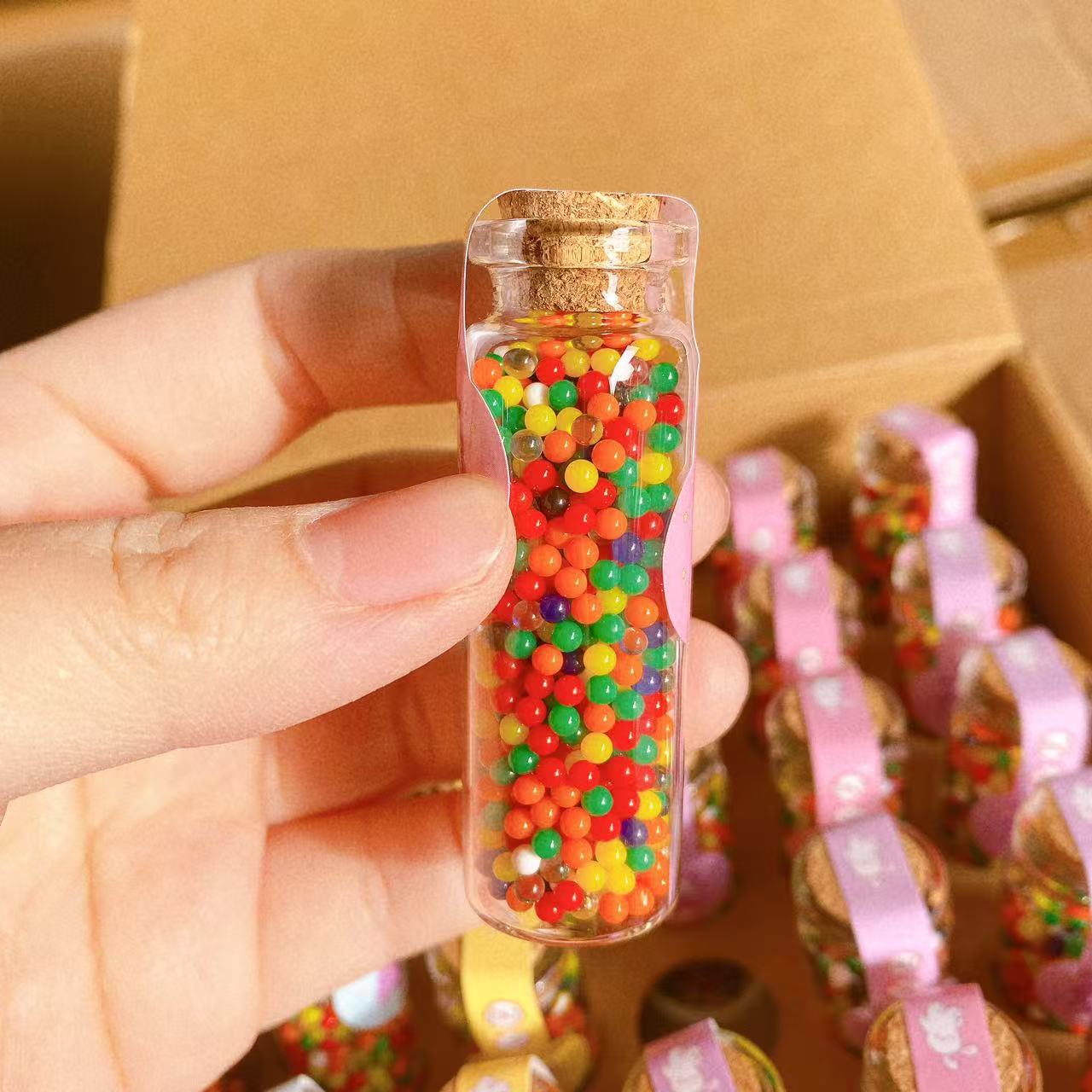 Botella de rafting gran perla descomprimida mar bebés juegos de agua coloridos niños rompecabezas bola de cristal juguetes estand tienda 2 yuanes