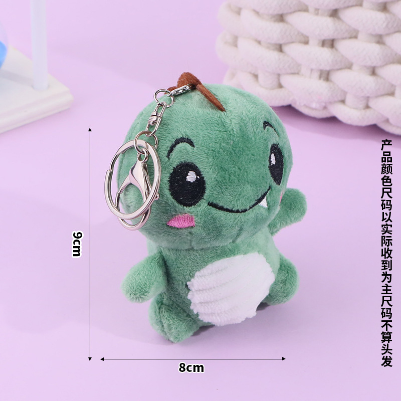 Lindo rubor pequeño sentado dinosaurio llavero de felpa bolso escolar colgante colgante máquina de garras muñeca muñeca regalo