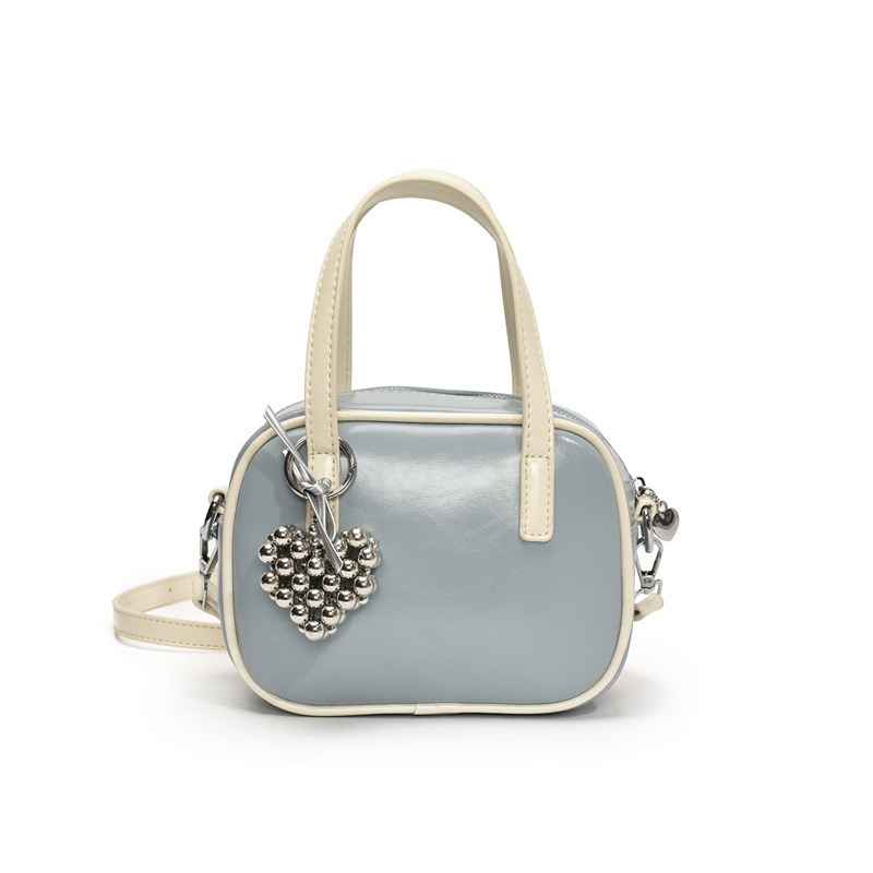 Bolsos populares de este año 2025 primavera nuevo bolso femenino con cuentas de amor bolso de hombro pequeño bolso de mensajero de color de contraste fresco