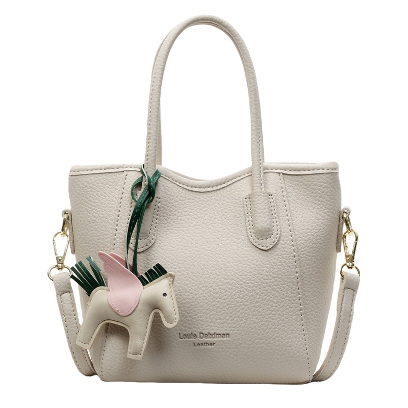 Bolsa de cubo portátil de estilo occidental de alta calidad para mujer 2025 nuevo bolso de mensajero de hombro de viajero de estilo explosivo de moda salvaje