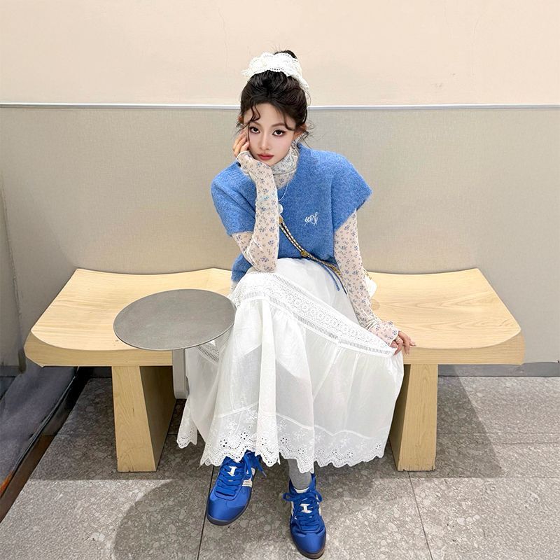 Preppy style, sweet and youthful, blue knitted sweater vest, floral print undershirt, and lace half-skirt – a three-piece set for women