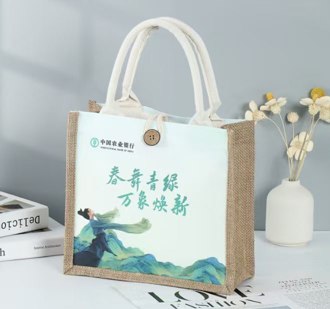 この青い緑のキャンバスだけが麻布をつなぎ合わせて手提げ袋を包む企業の創意の特包農業銀行の麻布袋を包んでカスタマイズします。|undefined