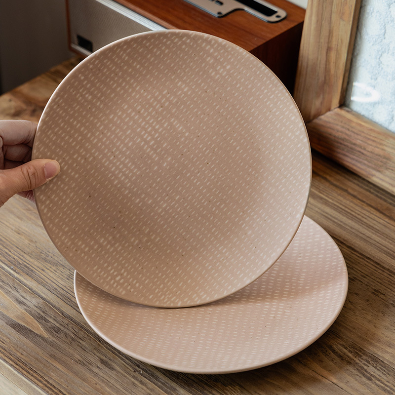 Plato rosa de alto valor de color, plato de postre, plato de cerámica de punto blanco creativo, platos redondos caseros retro, platos de cubiertos al por mayor