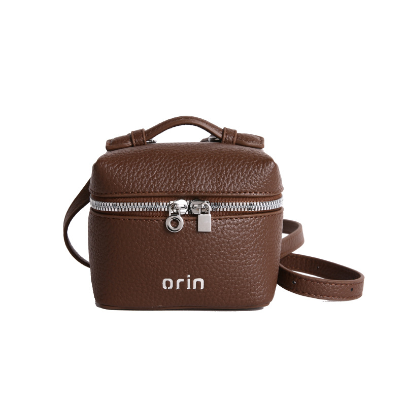 2026 nuevo bolso infantil coreano litchi patrón bolso de caja para hombres y mujeres bolso de cambio de color sólido mini