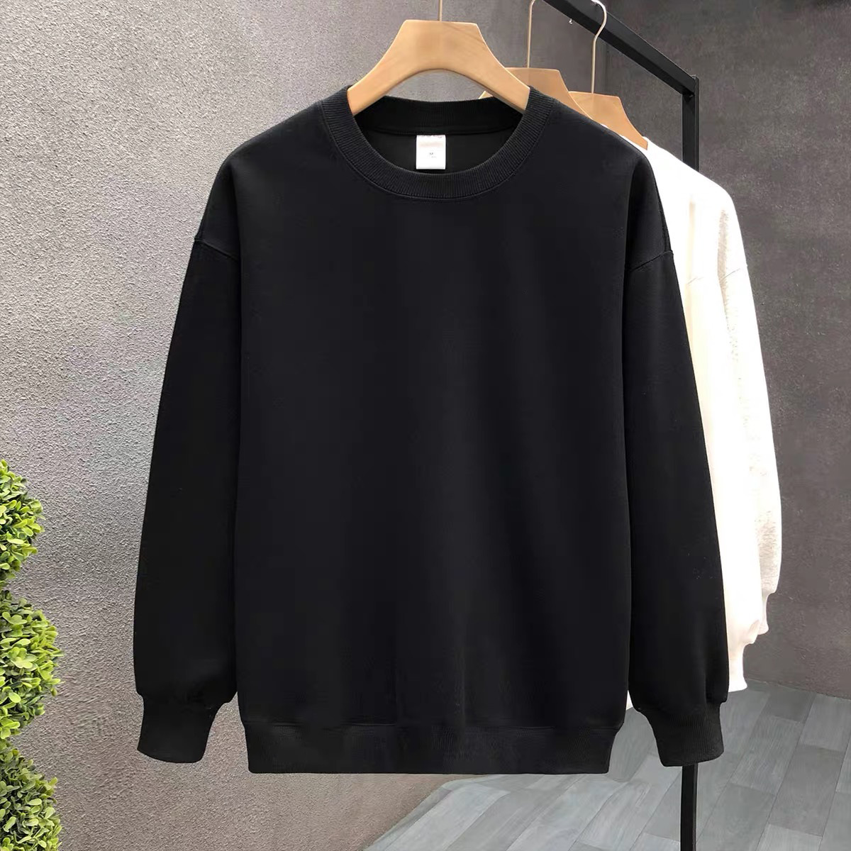 Suéter de algodón negro pesado de alta gama para mujeres 2025 otoño y invierno nuevo estilo europeo y americano camiseta de manga larga fondo suéter de estudiante