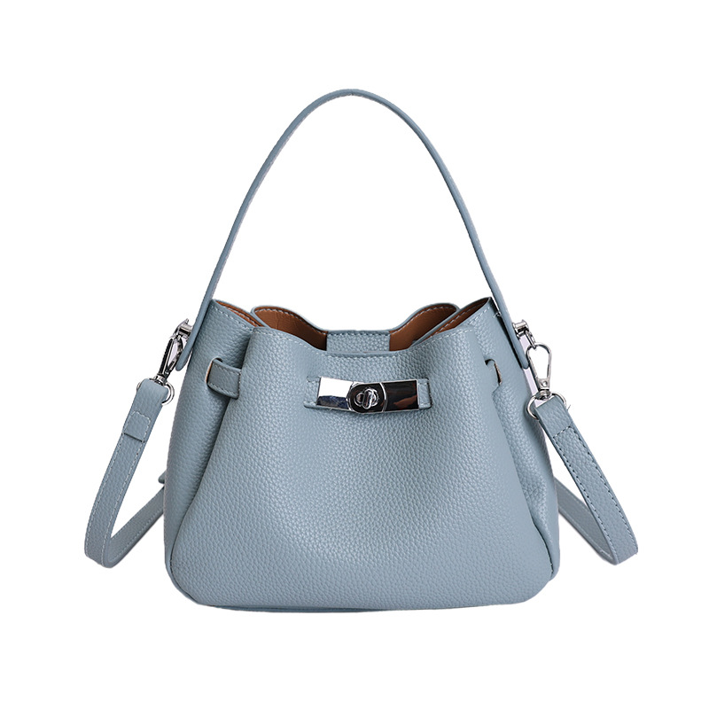 Coreano de nicho de alta calidad canasta de verduras, bolso de cubo de mano para mujeres 2026 nuevo estilo extranjero, lujo ligero y versátil bolso de mochila