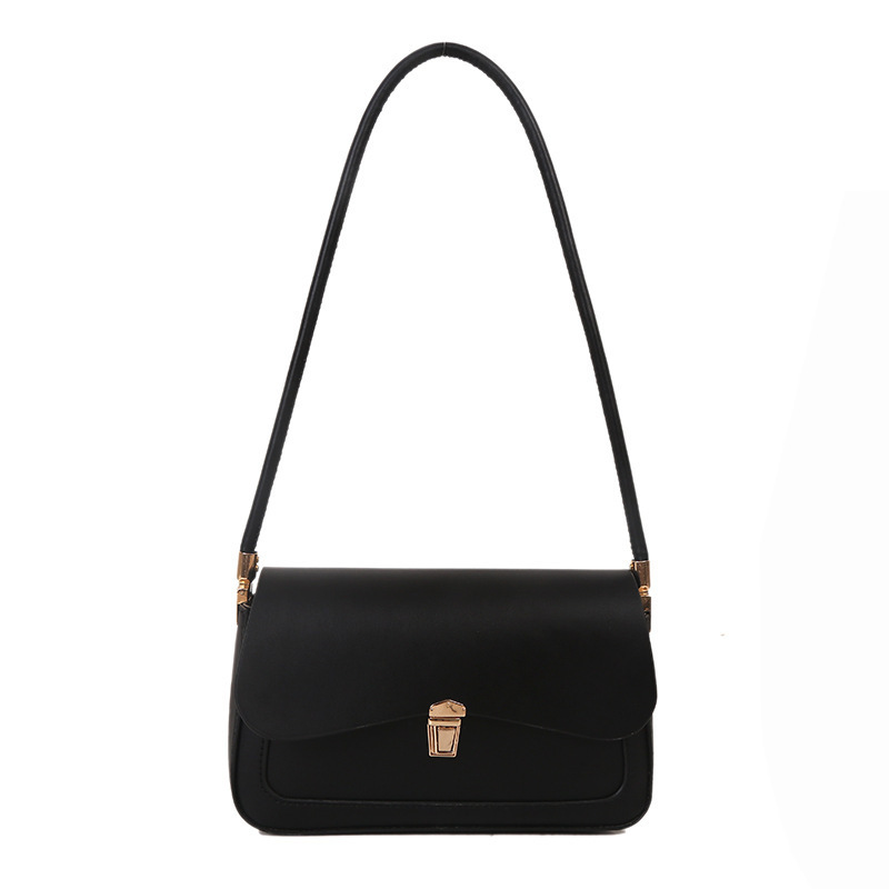 2024 otoño y invierno bolsos de mujer de moda francesa nicho bolsos de hombro de brazo irregulares bloqueo textura popular bolsos de mujer