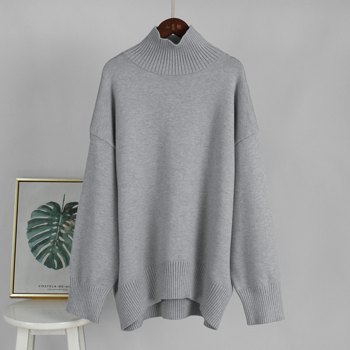 Suéter de cuello alto transfronterizo para mujeres 2025, Europa y los Estados Unidos de otoño y invierno explosivo color sólido jersey de punto de cuello alto suéter suelto para mujeres