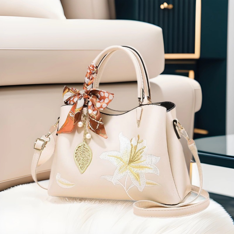Regalo del Día de la Madre 2025 nuevo estilo de alta sensación de bordado bolso portátil bolso de moda para mujeres de mediana edad