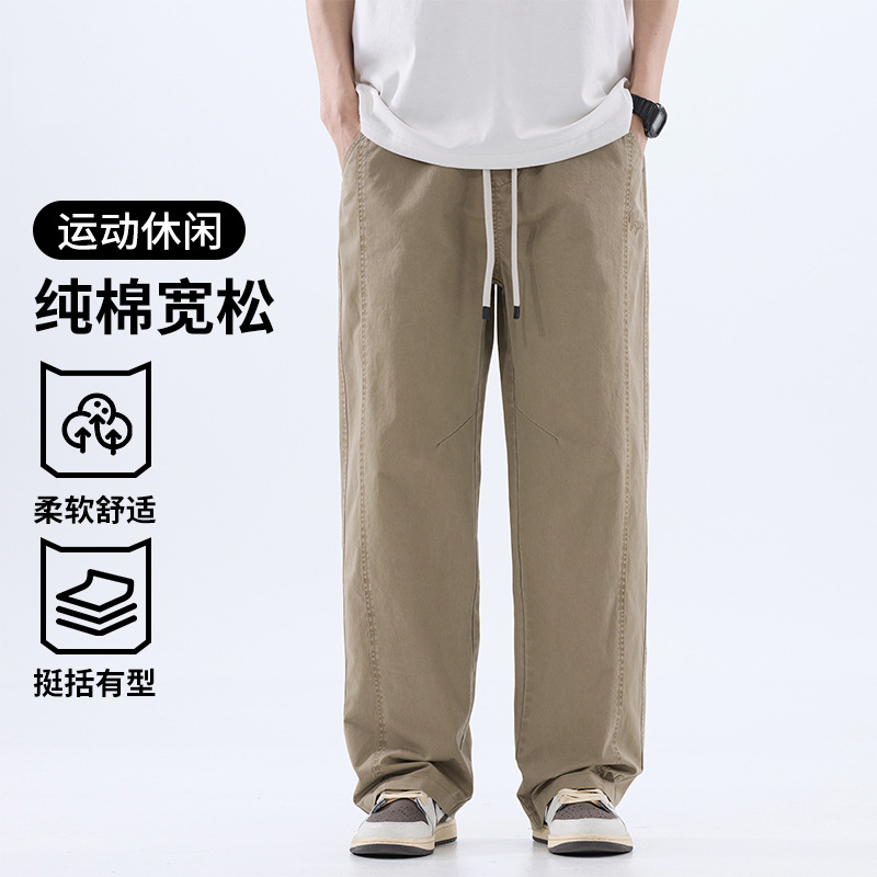 綿のカジュアルなズボンの男性のストレートのゆったりしているズボン2025夏の薄いタイプのファッションの防風傘兵の広い足のズボンの男性