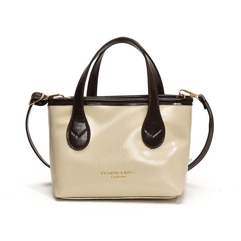 Bolso de cubo de textura de color sólido para mujer 2025 primavera nueva moda bolso de mensajero coreano estilo occidental de alta gama para mujer