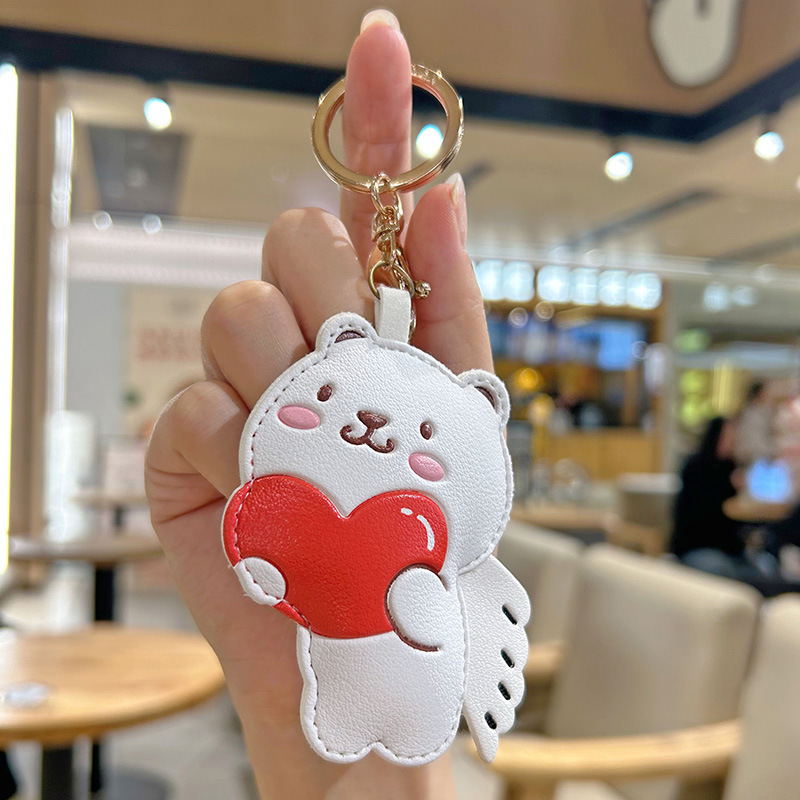 カスタム卸売りの新しいかわいい皮質抱心カップルのキーホルダー女子バッグのアイデア装飾ペンダント|undefined