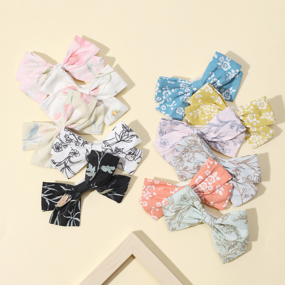 Fermagli per capelli con fiocco per bambine clip stampate_voghion.com