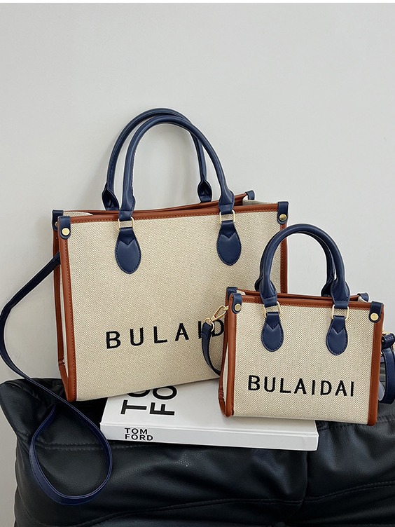 Bolsos para mujer 2026, nuevo estilo de moda, bolso tote de lona con logo bordado, bolso de mano de alta gama, bolso bandolera para el día a día