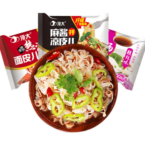 A large bag of hot red oil cold noodles with a topping of sesame paste, a bag of instant spicy sour noodles for easy consumption, convenient ready-to-eat food.