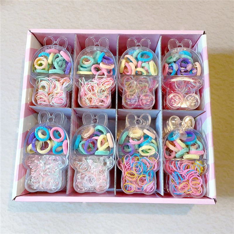 Invierno nuevo color transparente en caja cuerda de pelo accesorios para el cabello dos en uno joyería de las niñas anudadas dos yuanes tienda de tocado al por mayor