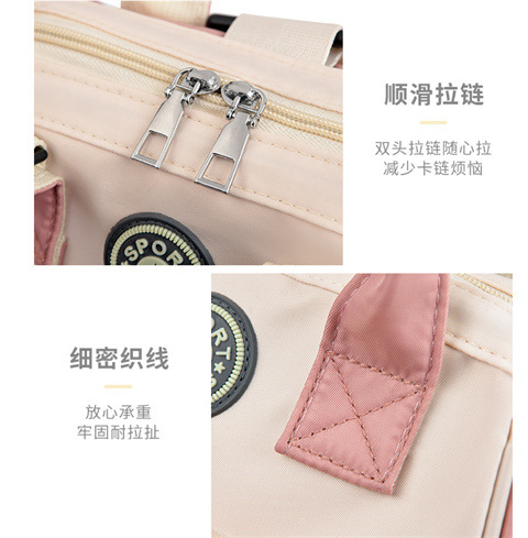The Mommy bag is small and cute. It has a detachable front pocket and is a multi-functional baby bag. It is waterproof, lightweight, and has a crossbody design. It can be used to carry milk bags undefined