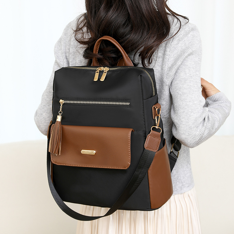 Mochila de tela de nailon nueva transfronteriza para mujer, bolso de viaje de ocio ligero y versátil de gran capacidad, mochila con flecos