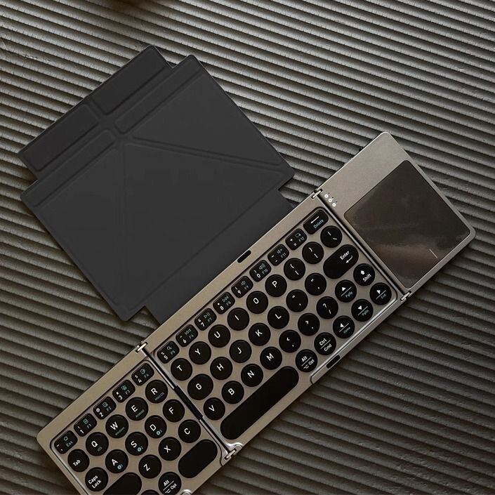 Newly Launched Leather Case-Style 70% off Fold Wireless Bluetooth Keyboard with Touchpad, Round Keycaps, Portable Folding Keyboard Newly Launched Leather Case-Style 70% off Fold Wireless Bluetooth Keyboard with Touchpad, Round Keycaps, Portable Folding Keyboard