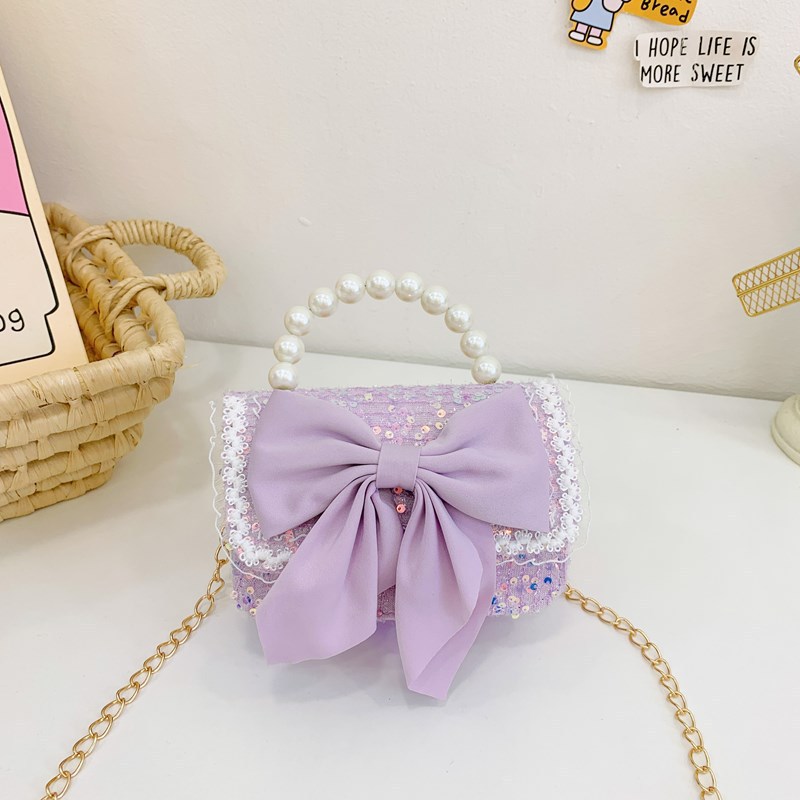 Otoño y invierno coreano arco camellia bolsas de niños de encaje de mano perlas bolsas mochilas para niñas de jardín de infantes